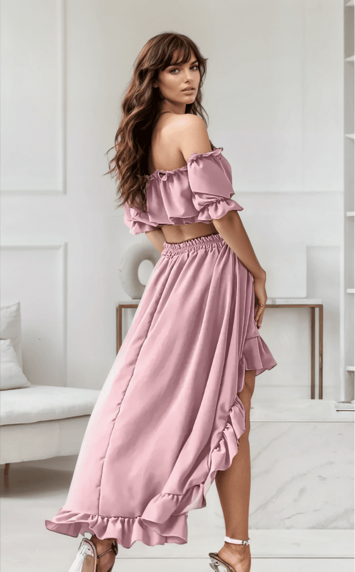 Elegant two-piece ruffle dress in soft pastel pink, designed for beach vacations and chic casual wear